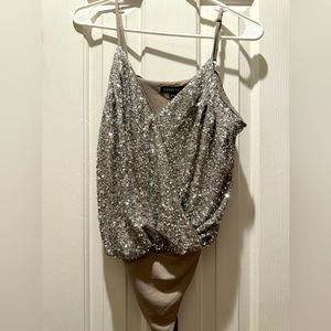 Beautiful, SILVER sequin body suit, never worn.